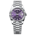 Watch with purple face and silver band on white background