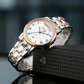 BERNY Women’s Quartz Watch – Roman Numerals, Day & Date, Sapphire Glass, Stainless Steel Strap
