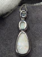 Time & Lustre double drop opal pendant necklace featuring iridescent white opals in a polished silver-tone setting.