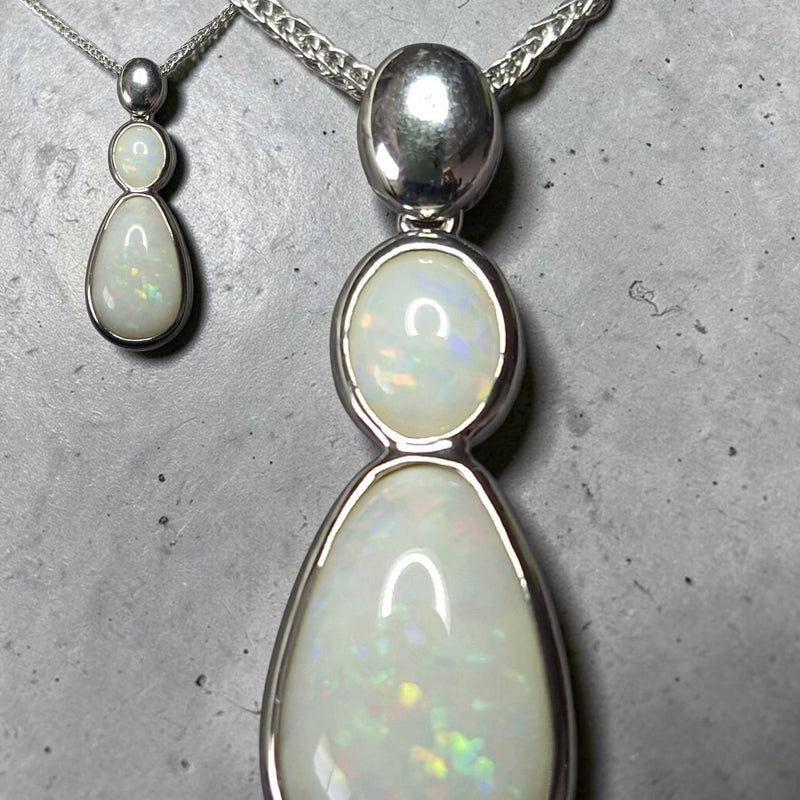 Time & Lustre double drop opal pendant necklace featuring two white opals in polished silver-tone metal settings.