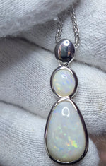 Time & Lustre double drop opal pendant necklace featuring two white opals with iridescent flashes in polished silver