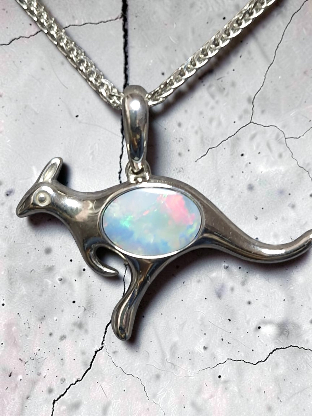 Time & Lustre sterling silver kangaroo pendant featuring a genuine opal with vibrant pink and blue play-of-colour.