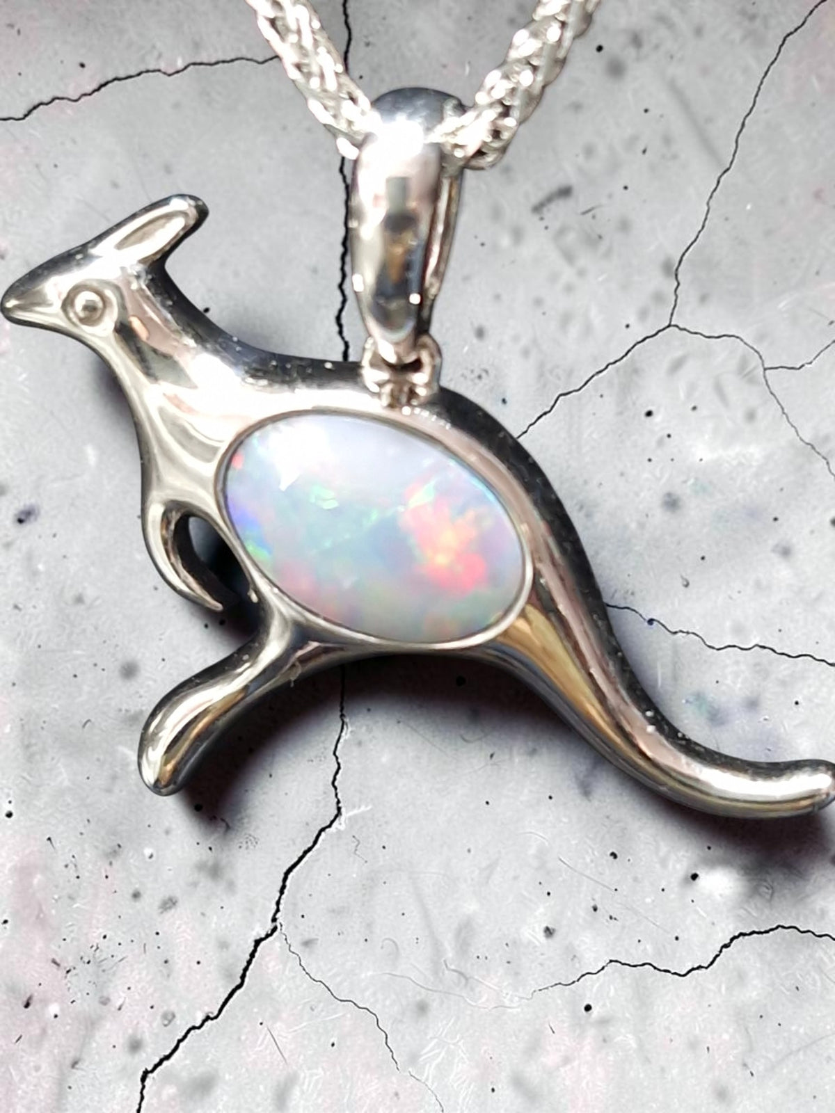 Time & Lustre kangaroo pendant necklace in sterling silver featuring a genuine opal with vibrant colour flashes.