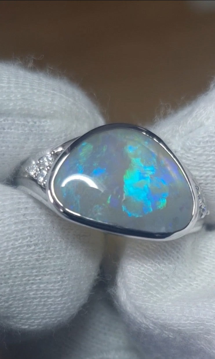 Time & Lustre sterling silver ring featuring a 2.5 ct Lightning Ridge crystal opal with blue and green flashes.