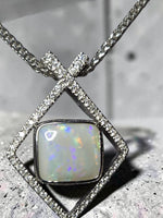 Time & Lustre Lightning Ridge opal pendant in a geometric sterling silver frame with lab grown diamond accents.