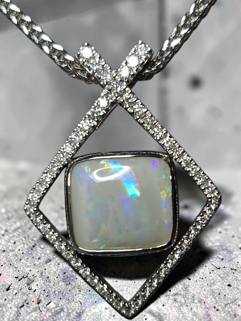 Time & Lustre Lightning Ridge opal pendant in a geometric diamond-encrusted sterling silver frame on a woven chain.