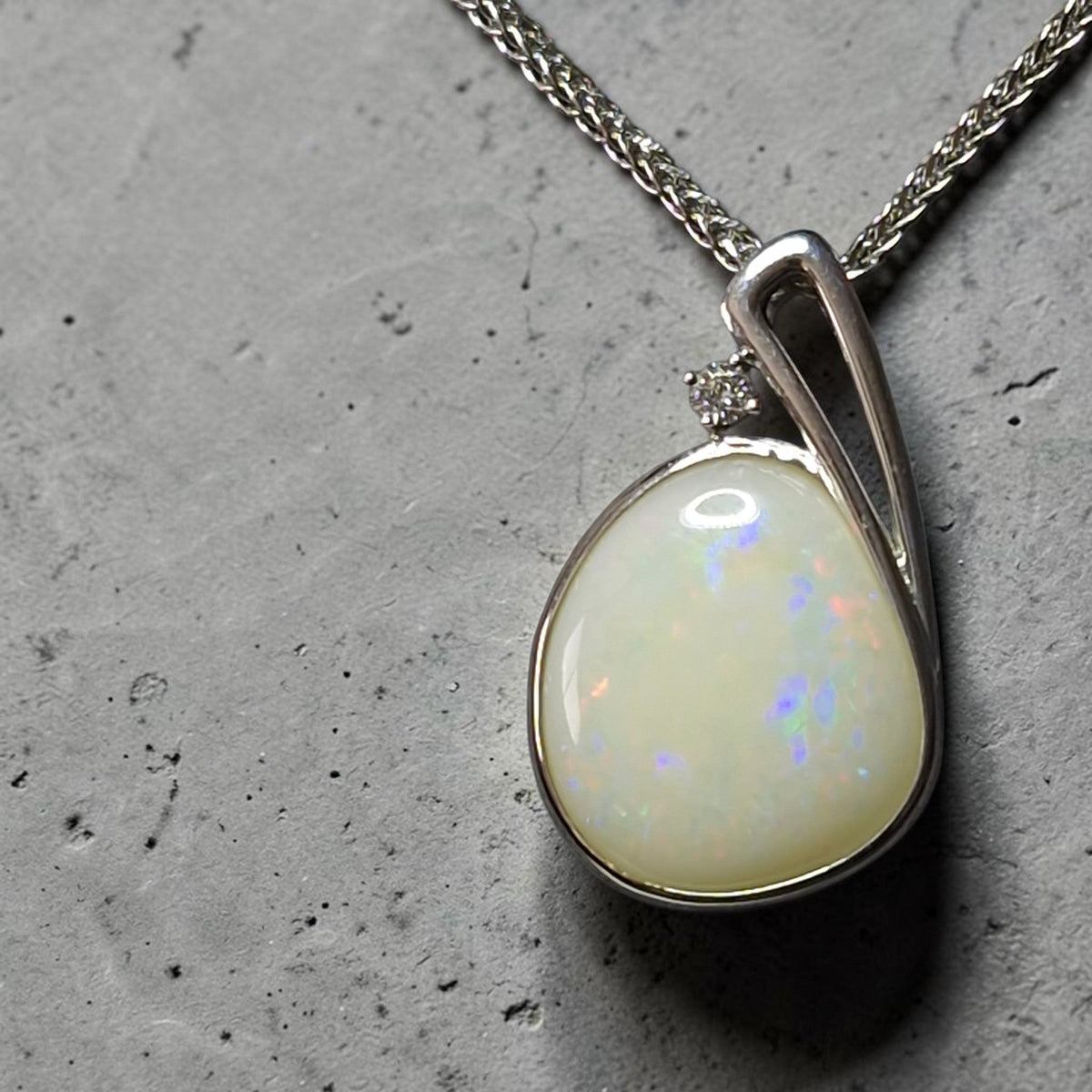 Time & Lustre teardrop Coober Pedy opal pendant in sterling silver with a sparkling lab diamond accent