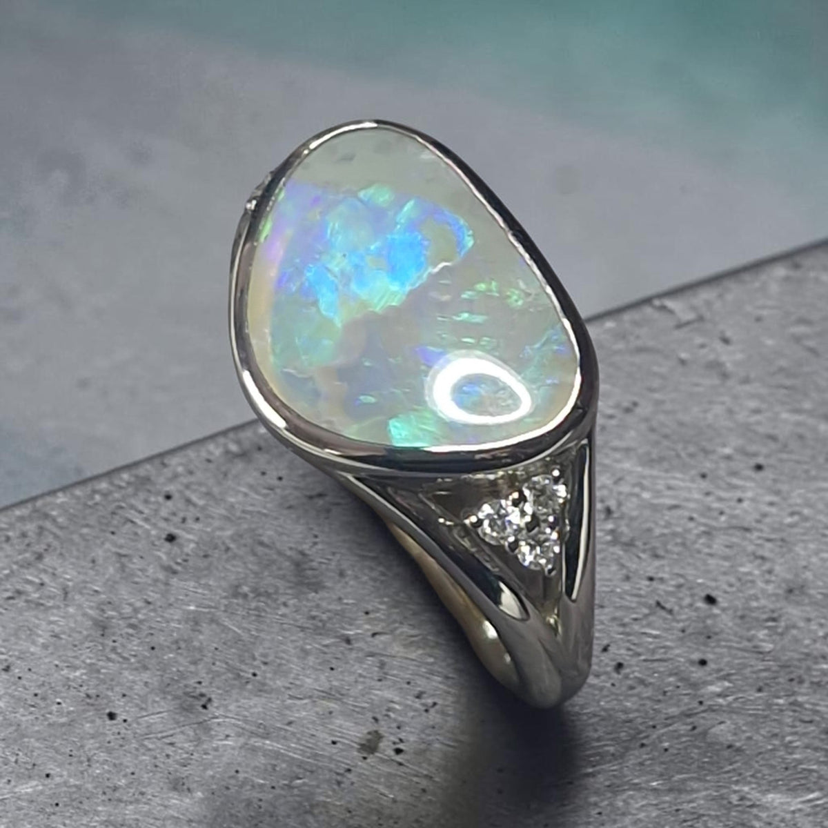 Time & Lustre sterling silver ring featuring a free-form Lightning Ridge crystal opal and lab grown diamond accents.