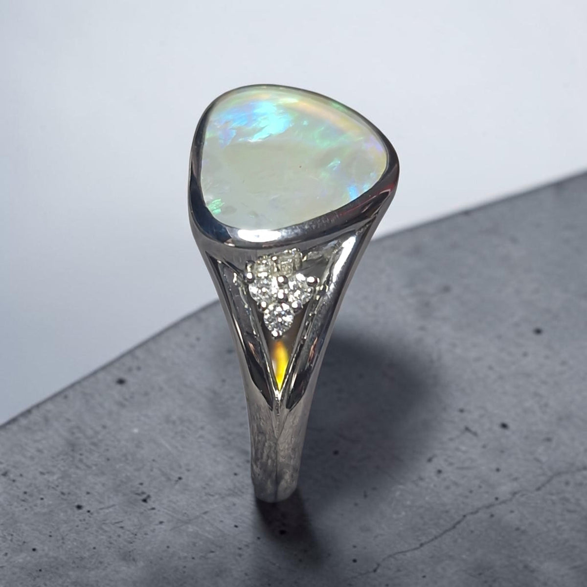 Time & Lustre sterling silver ring featuring a free-form Lightning Ridge crystal opal and lab grown diamond accents.