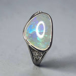 Time & Lustre sterling silver ring featuring a free-form Lightning Ridge opal with blue and green flashes and diamonds.