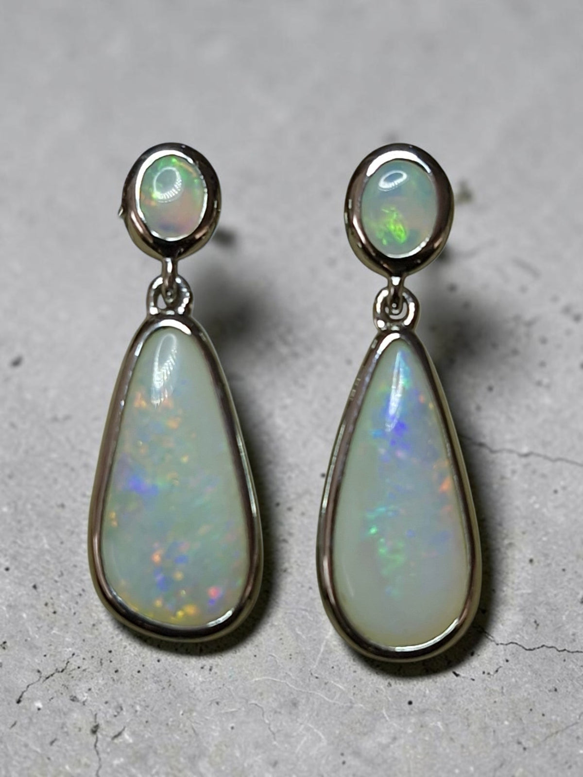 Time & Lustre elegant drop earrings featuring teardrop Australian opals set in polished sterling silver
