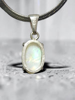 Time & Lustre oval opal pendant in 925 sterling silver with a four-prong setting on a silver chain