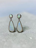 Time & Lustre teardrop opal drop earrings in polished sterling silver with oval studs and iridescent gemstone finish.