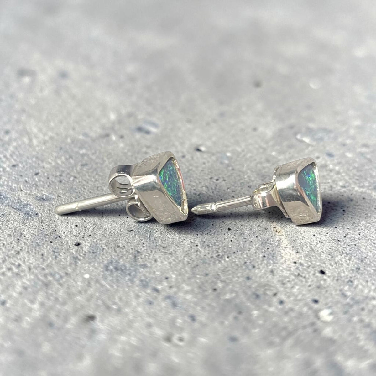 Time & Lustre triangle-cut black opal stud earrings in sterling silver settings with blue and green colour flashes